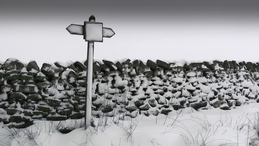 Winter Sign Post.
A sign post covered in snow in front of a Drystone wall.