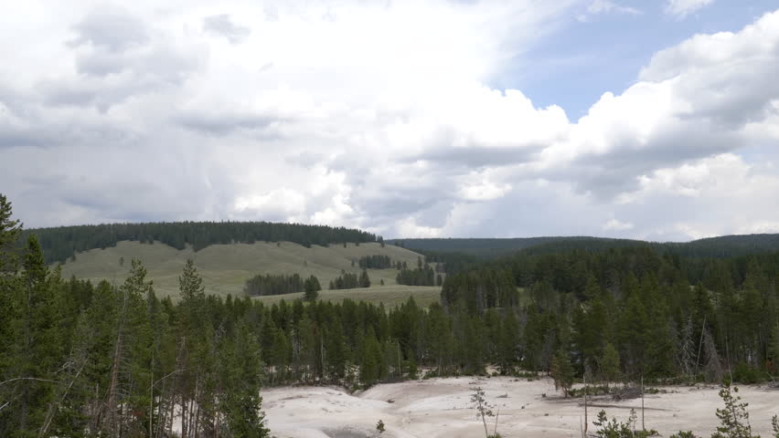 a tilt down wide shot of sulphur caldron in yellowstone national park, usa