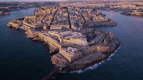 4k aerial drone footage - Capital city of Valletta, Malta at sunrise.  Ancient Medieval city, World Heritage Site.  