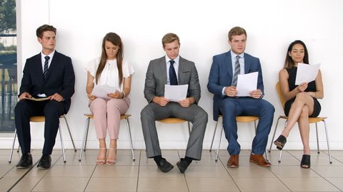 Group Of Job Candidates Waiting For Interview In Office