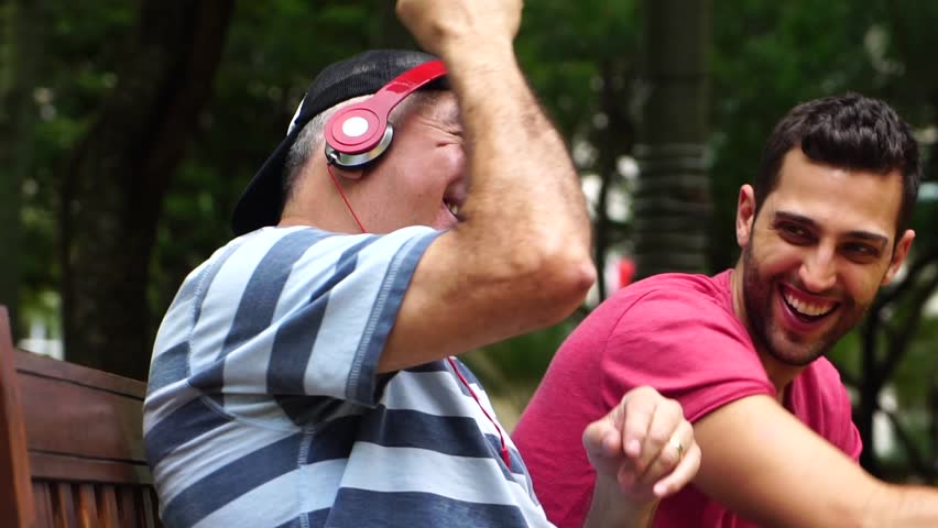 Two Friends/ Father and Son Dancing, Listening Music and Having Fun