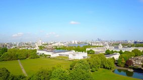 Aerial bird's eye view video taken by drone of Greenwich park with views to Canary Wharf, Isle of Dogs, London, United Kingdom