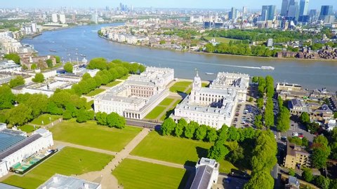 Aerial drone video of Greenwich park with view to Canary Wharf financial district, Isle of Dogs, London, United Kingdom
