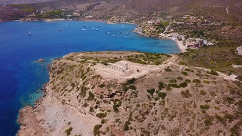 Aerial drone bird's eye video taken by drone of archaeological site of Cape Sounio, Temple of Poseidon, Attica, Greece
