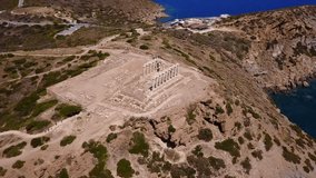 Aerial drone bird's eye video taken by drone of archaeological site of Cape Sounio, Temple of Poseidon, Attica, Greece