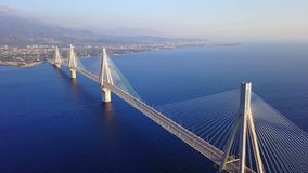 Aerial bird's eye drone video of state of the art suspension bridge crossing the sea