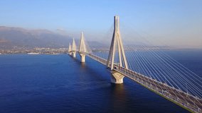 Aerial bird's eye drone video of state of the art suspension bridge crossing the sea