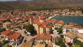 Aerial birds eye view video taken by drone from picturesque and historic fishing village of Galaxidi, Fokida, Greece