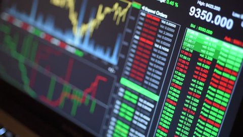 Bitcoin trading screen graphs and figures showing booming crypto currency 