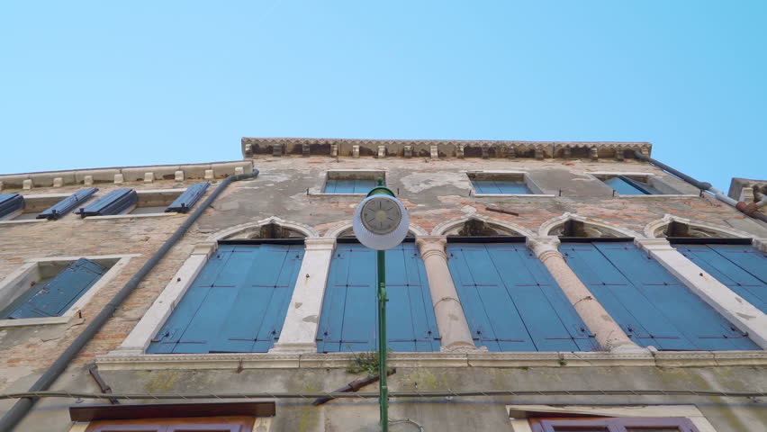 Closer look of the bulb from the streetlamp in the middle of the city in Venice Italy