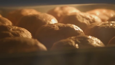 Baking bread in bakery oven with high temperature at kitchen. time lapse shot
