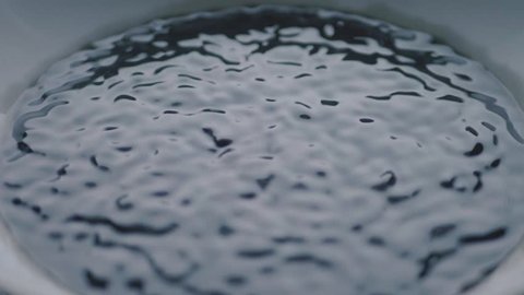 Subwoofer Audio Speaker Vibrations and Black Water Liquid Plate. Slow Motion
