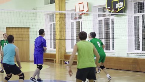 MOSCOW - NOV 8, 2016: People train during volleyball game in Elk Island residential complex