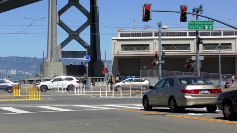 Street scene in San Francisco, California, USA, with the Bay Bridge in the background, circa May 2017