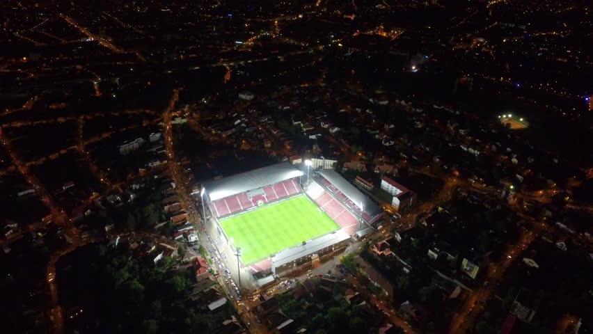 Aerial shot of a football stadium at night before a soccer game
