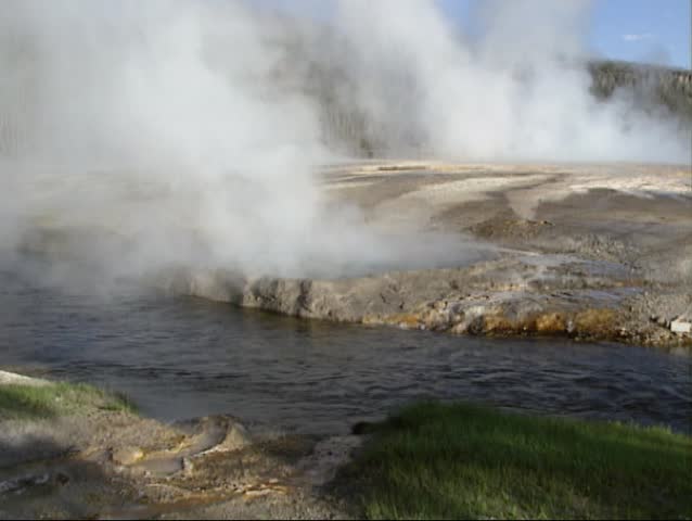 Yellowstone National Park: Bubbling water in Cliff geyser on the edge of Iron Creek, Black Sand Basin.