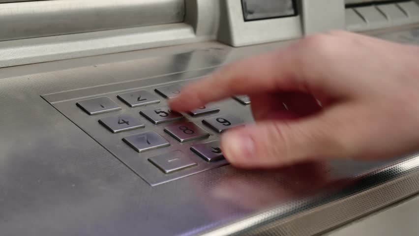 Female hand enter atm banking cash machine pin code. Woman pressing keypad of an ATM machine. | Shutterstock HD Video #33419731