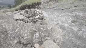 Ungraded 240 fps super slow motion of a stream with sparkling water (raw footage)