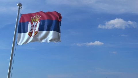 Airplane flying over waving flag of Serbia