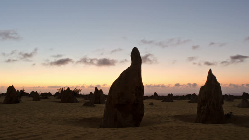 Time lapse of a silhouette of the Nambung National Park Pinnacles at sunset.