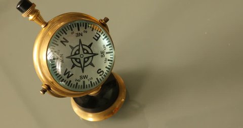 antique compass on office table