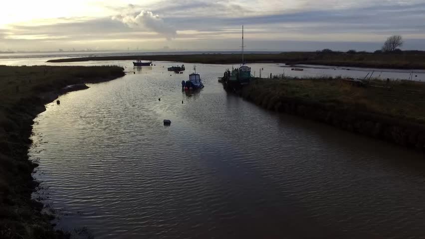 Boats in harbour at Sunset, winter, East Riding of Yorkshire, England