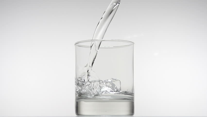 Pouring glass of water in slow motion on white background. fullHD video shot at
