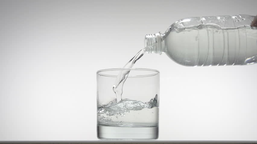 Pouring glass of water in slow motion on white background fullHD video shot at
