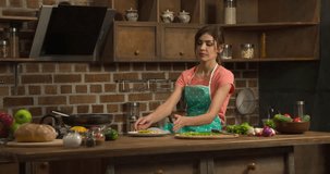 Woman eating omlette on home kitchen 4k video. Female dinner meal: omelette or fried eggs on plate. Cooking and preparing food
