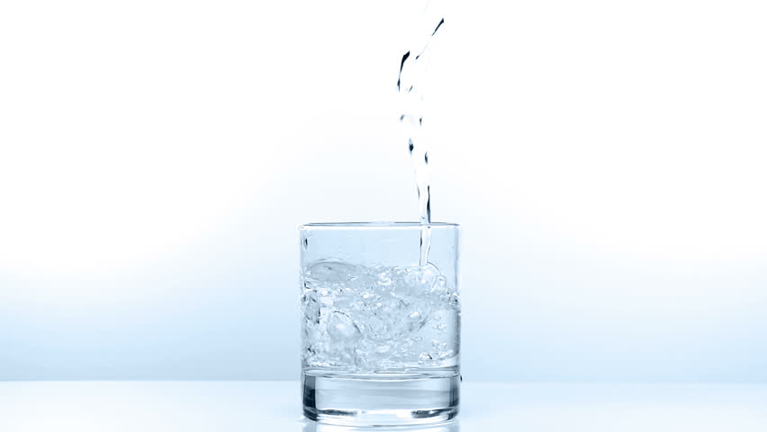 Pouring glass of water in slow motion on white background. fullHD video shot at