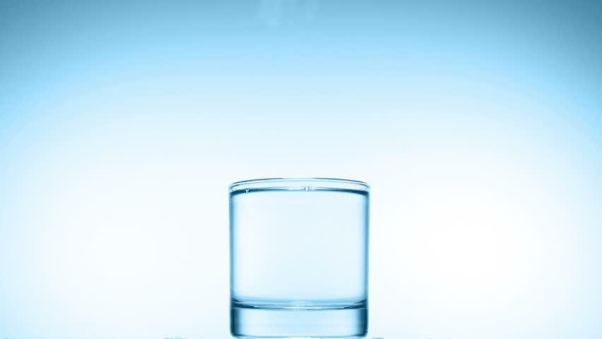 ice cube splash in glass of water on white, slow motion 250fps fullHD video