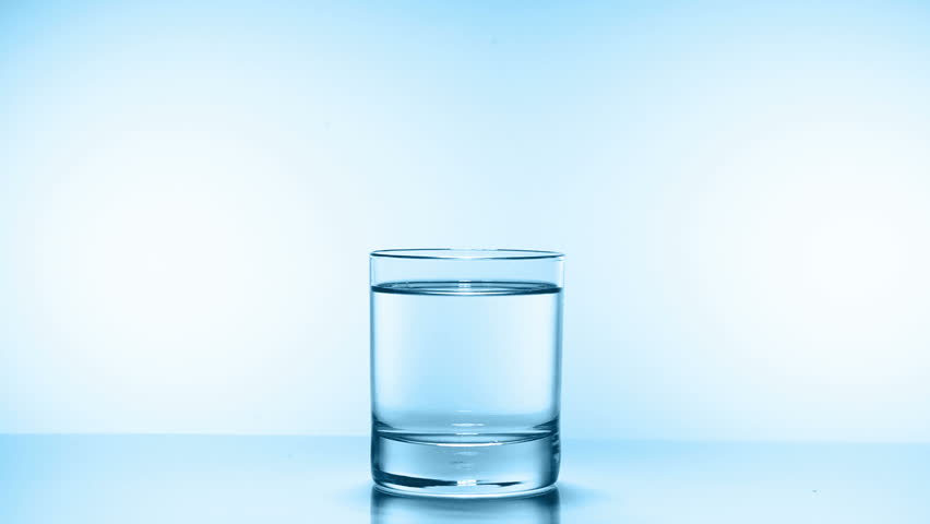 ice cube splash in glass of water on white, slow motion 250fps fullHD video