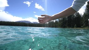 Human hand cupped to catch fresh water from mountain lake, Canada
People relaxation freshness concept, shot in Jasper national park in Alberta.
