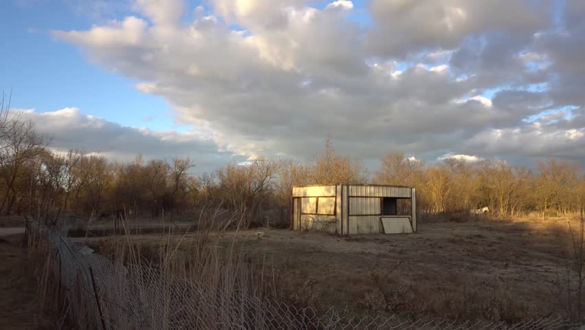 
panoramic movement on a shed in a meadow in the Camargue, which serves as a horse enclosure