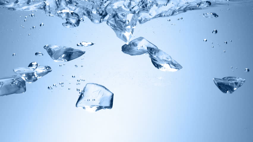 ice dropped into water with splash slow motion