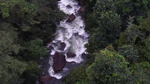 Real Time Aerial Footage of river stream in the jungle.Aerial footage of the waterfall in the national park.