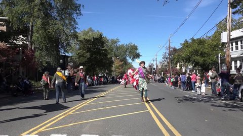 Somerville, Massachusetts, USA - OCTOBER 11, 2015 - Second day of HONK Festival of activist street bands. Brass Bands in outlandish costumes processing to Davis square playing and dancing