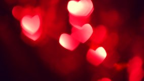 Valentine's Day Background. Holiday Blinking Abstract Valentine Background with Glowing Hearts. 4K UHD Video Footage. Heart Shape Bokeh. Love concept
