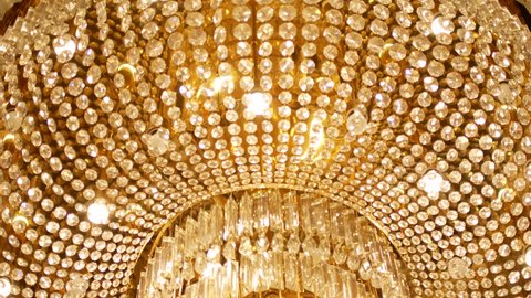 A very expensive chandelier in a chic restaurant or concert hall. Concept of luxury life. The video is suitable for the background
