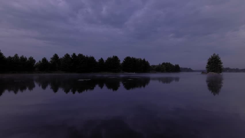 flying low over water and early morning mist on lake McKellar. GRADED FOOTAGE