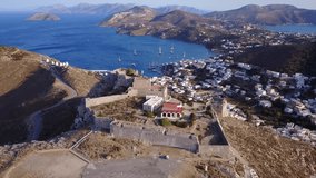 Aerial bird's eye view video taken by drone of beautiful fortified castle of Panteli, Dodecanese, Greece