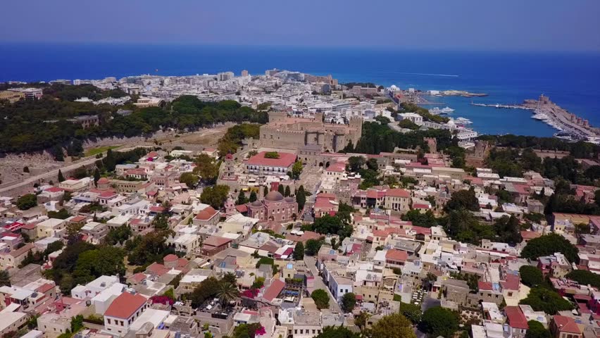 Aerial birds eye view video taken by drone of Rhodes island old fortified town, Palace of the Grand Master, a popular tourist destination, Dodecanese, Aegean, Greece