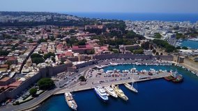 Aerial birds eye view video taken by drone of Rhodes island old fortified town, Palace of the Grand Master, a popular tourist destination, Dodecanese, Aegean, Greece