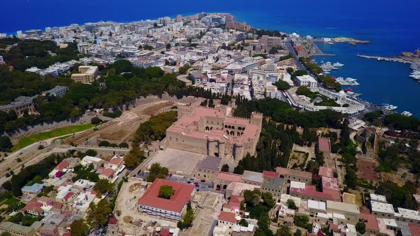 Aerial birds eye view video taken by drone of Rhodes island old fortified town, Palace of the Grand Master, a popular tourist destination, Dodecanese, Aegean, Greece | Shutterstock HD Video #33481777