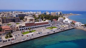 Aerial birds eye view video taken by drone of Rhodes island town Mandraki port a popular summer tourist destination, Dodecanese, Aegean, Greece