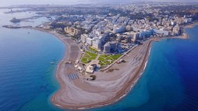 Aerial birds eye view video taken by drone of Rhodes island town peninsula and Elli beach a popular summer tourist destination, Dodecanese, Aegean, Greece