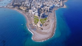 Aerial birds eye view video taken by drone of Rodos island town peninsula and Elli beach a popular summer tourist destination, Dodecanese, Aegean, Greece