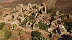 Aerial birds eye view video taken by drone of iconic medieval fortified village of Vatheia, Mani, Greece