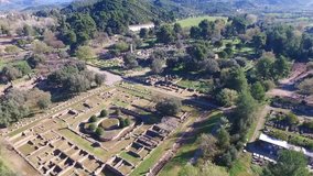Aerial bird's eye view video taken by drone of archaeological site of Ancient Olympia, Peloponnese, Greece