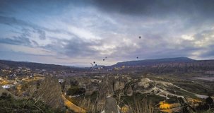 Hot air balloons flying over the valley at Cappadocia, Turkey. Timelapse.